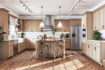 “Light-toned white oak kitchen cabinets with island and stainless appliances.
