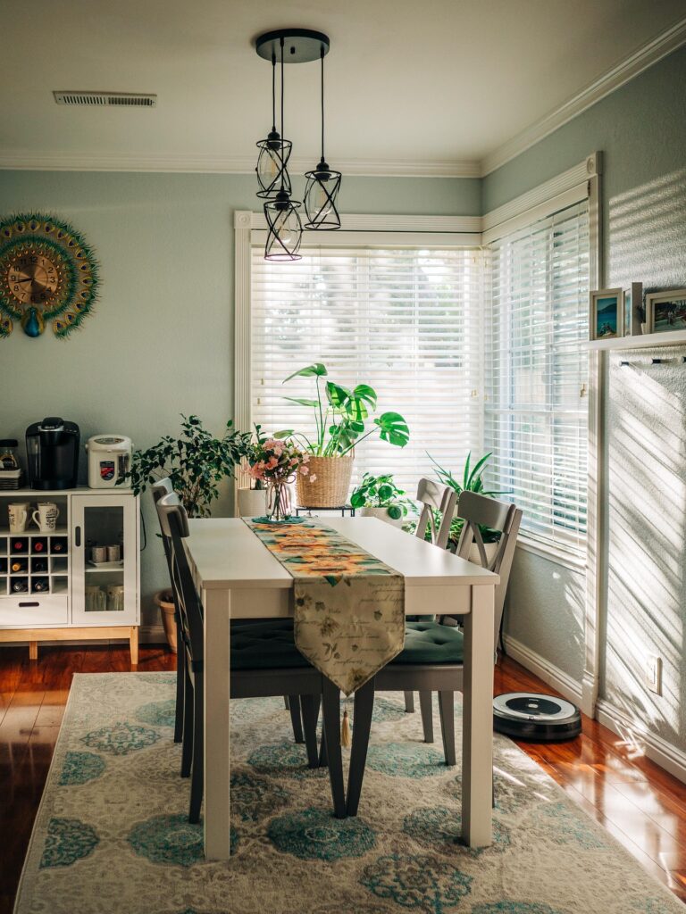 Elegant dining room with statement mirror and minimal art pieces